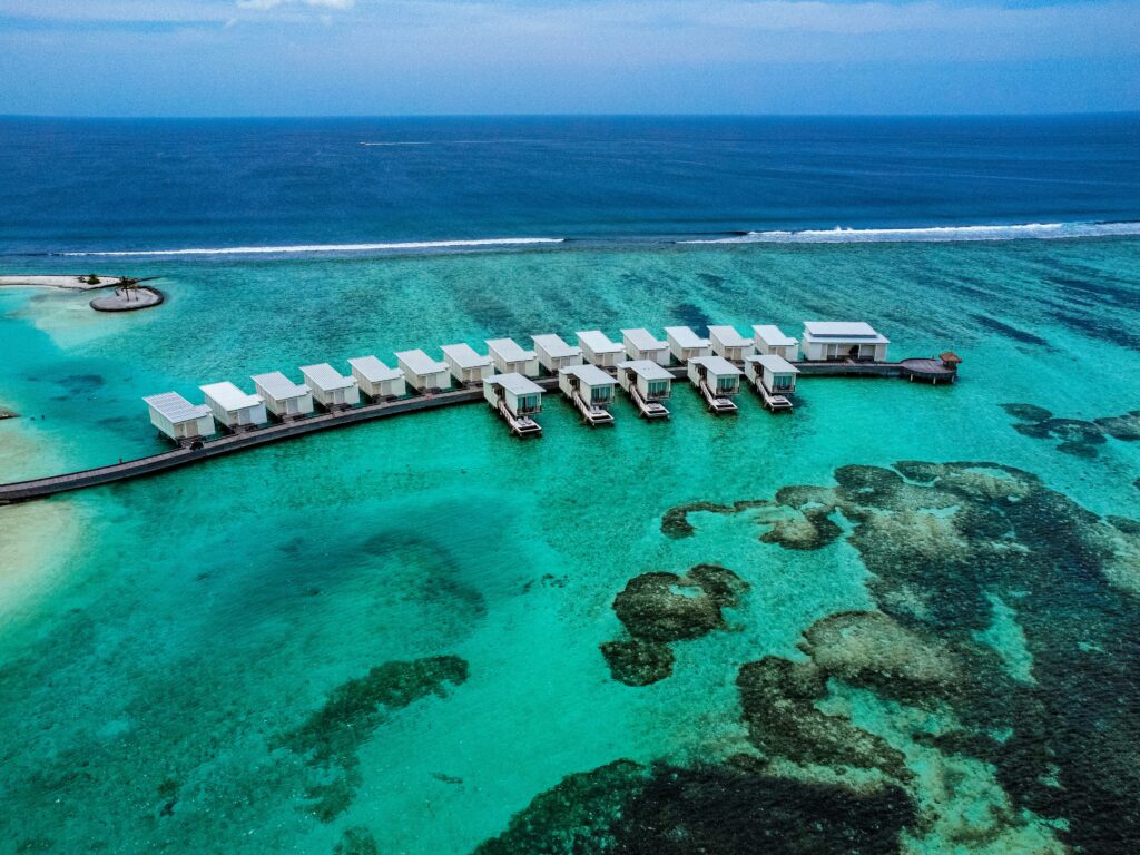 Overwater bungalows surrounded by turquoise water in the Maldives